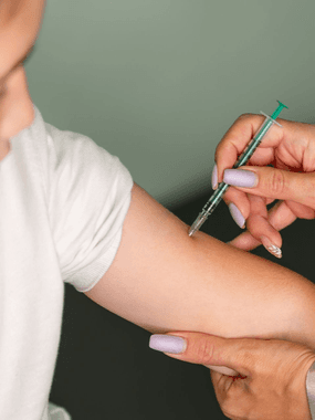 A patient getting a travel vaccination at Ashworths Clinic in Ashford, Kent, before leaving for a trip.
